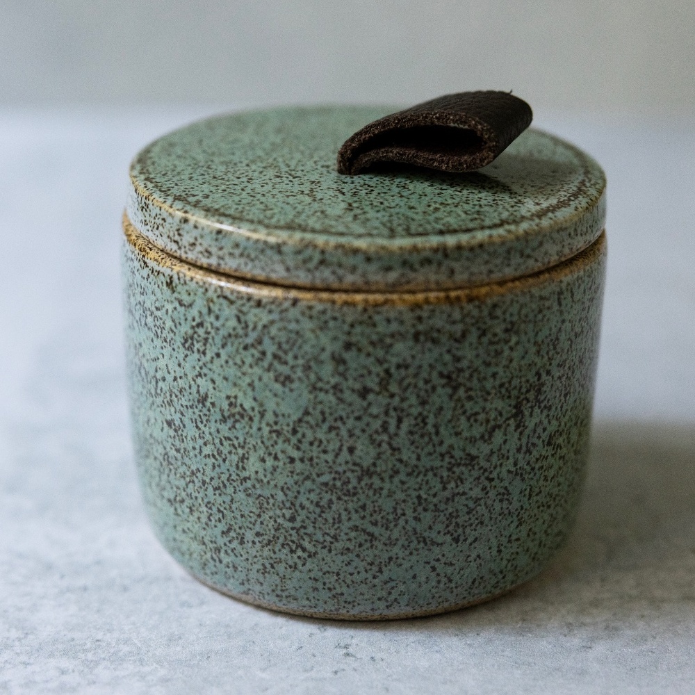 Green speckled ceramic pottery canister with lid brown leather handle